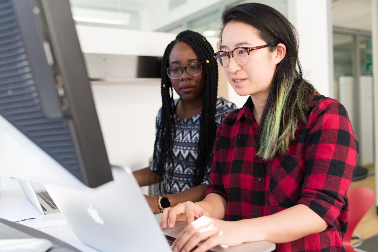two female software engineers working at computers