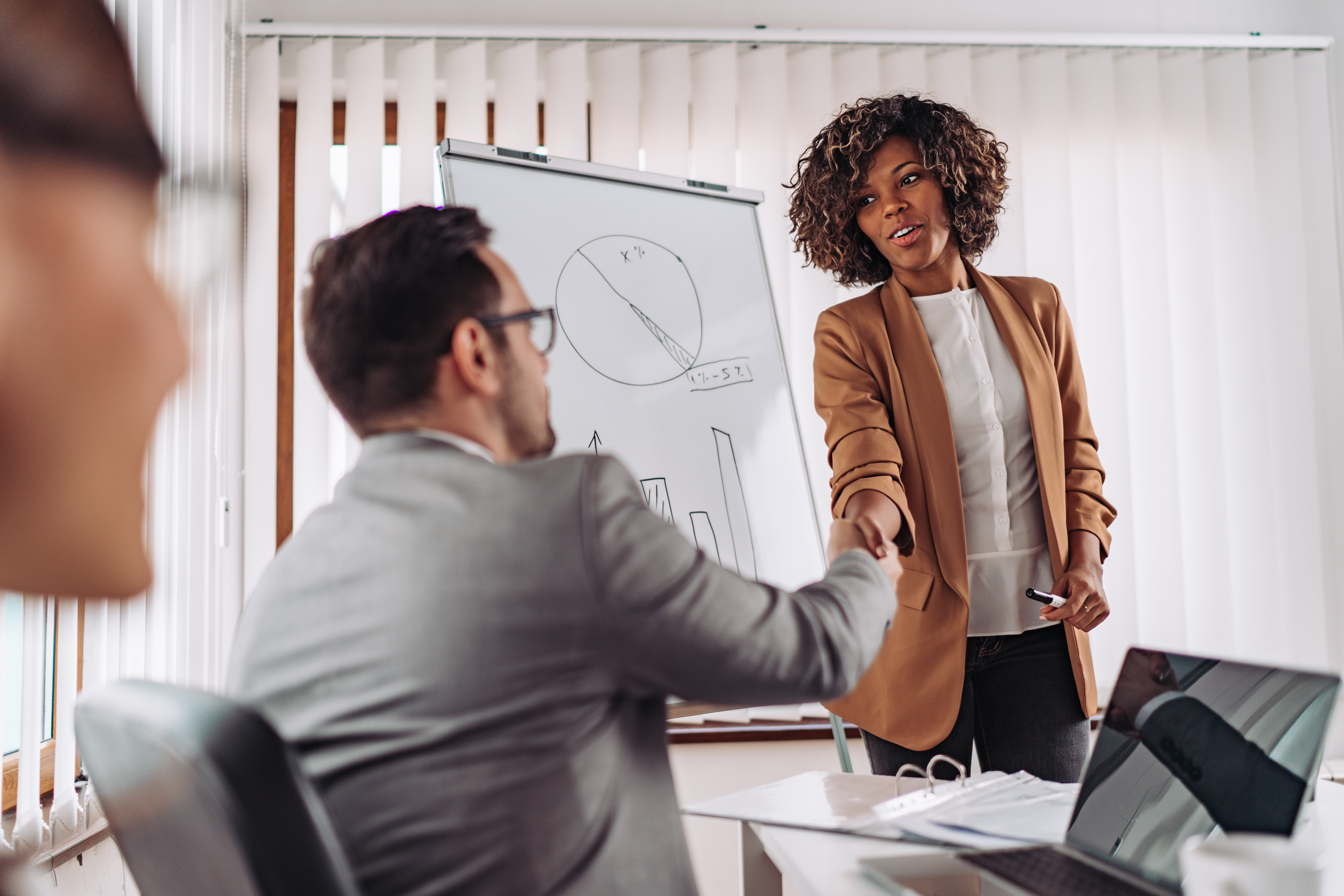 two businesspeople shaking hands