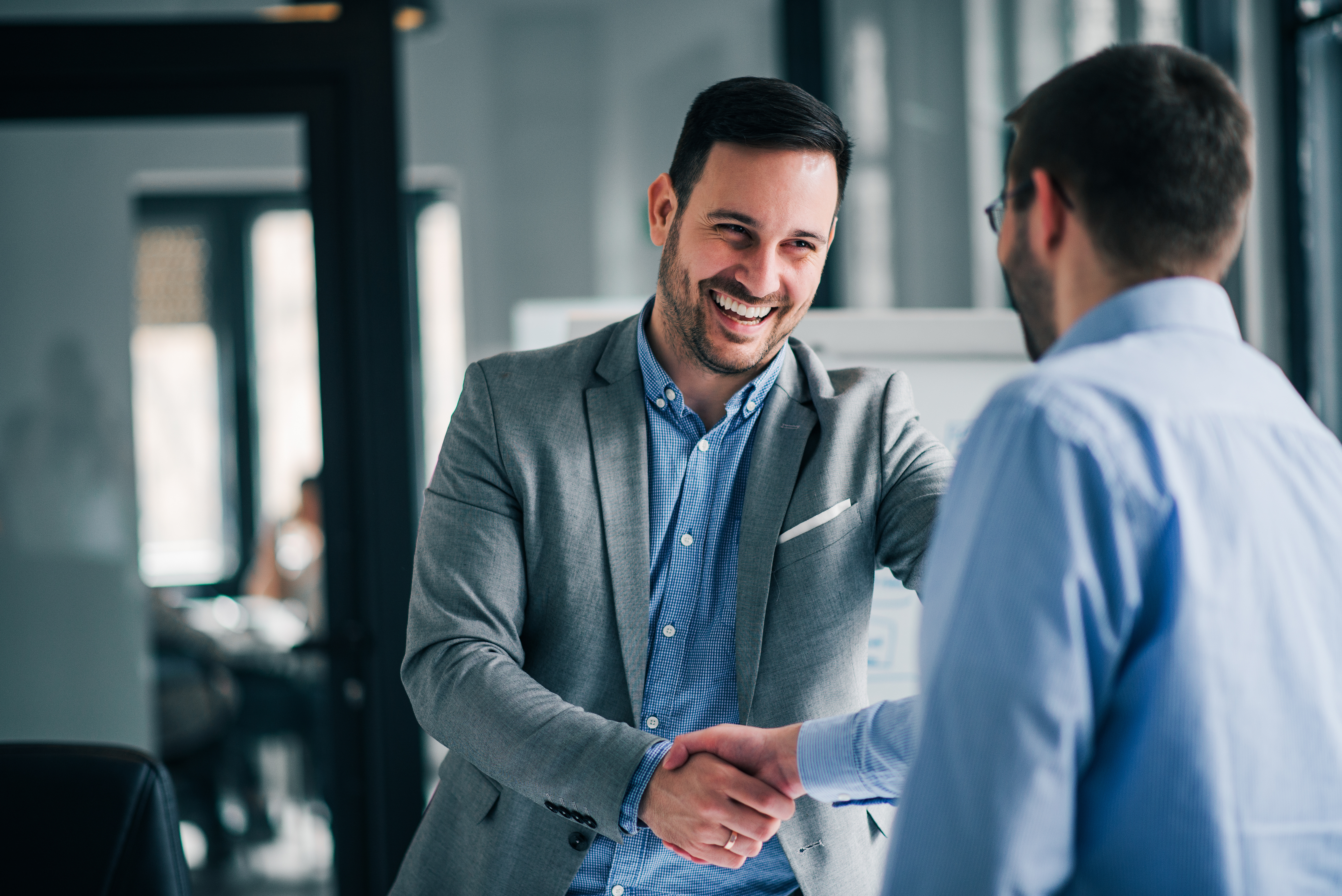 recruiter shaking hands with a candidate